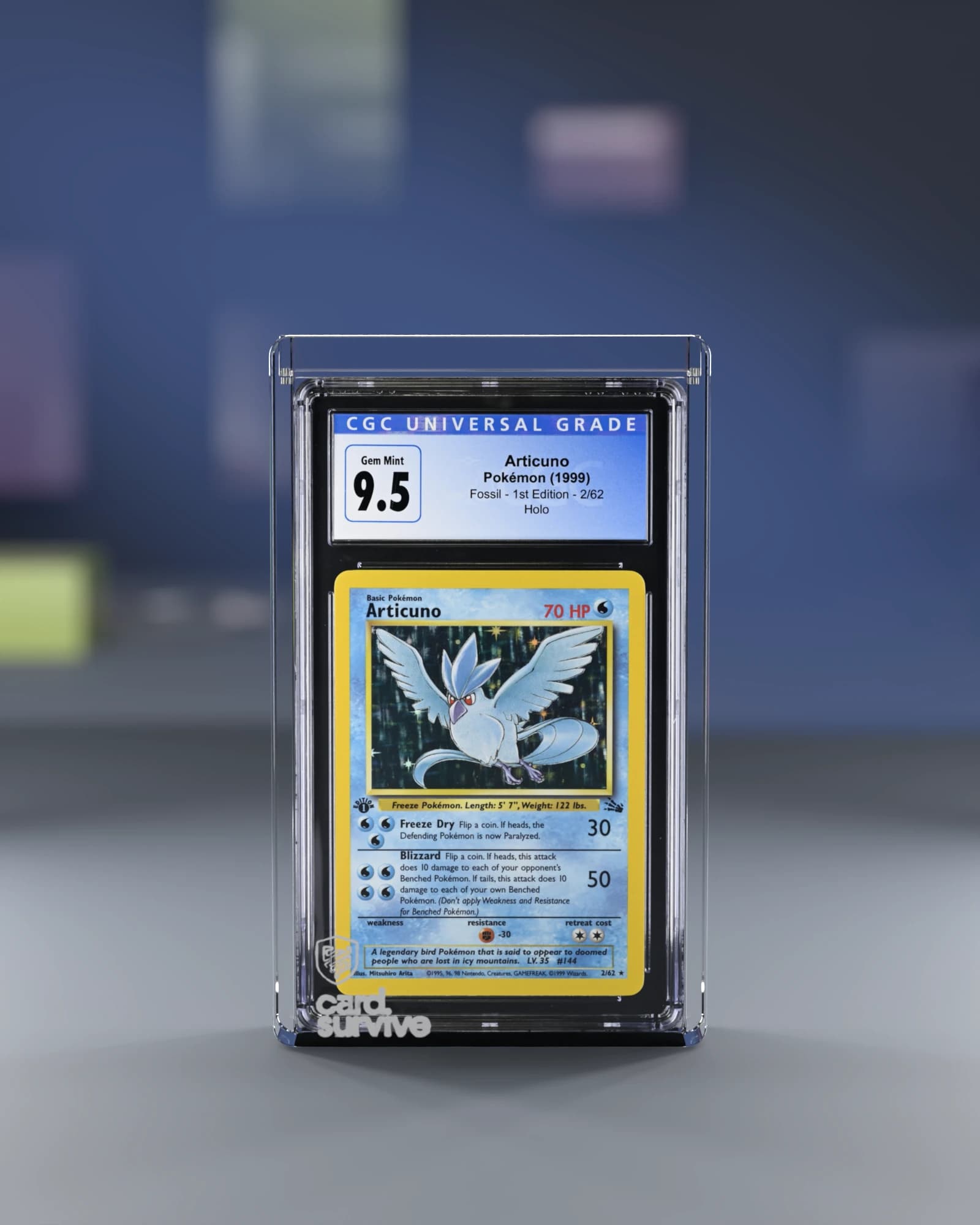 The Tank with a CGC slab of Articuno inside, front view, on a grading day desk with sleeves and toploaders, navy light.