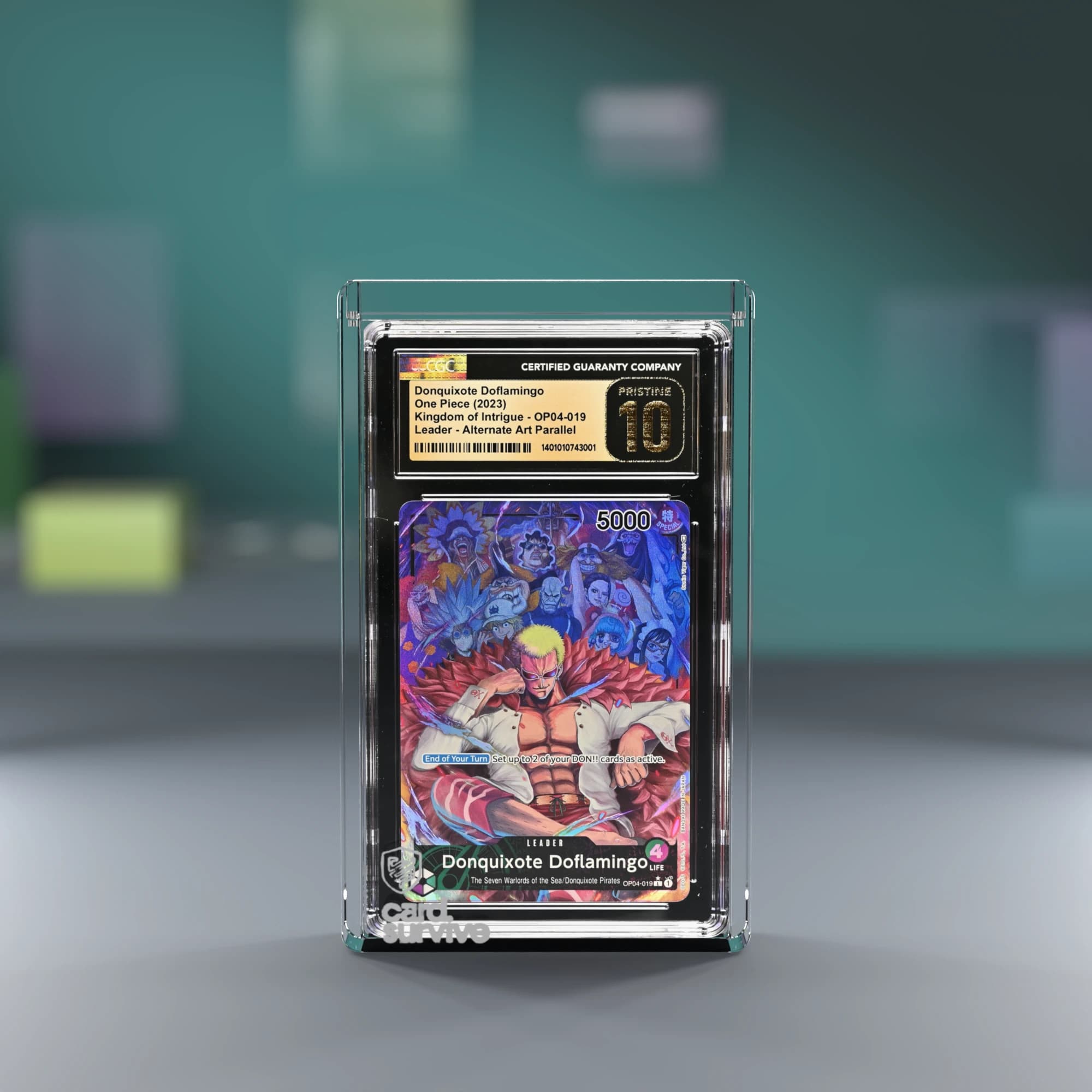 The Tank with a CGC slab of Donquixote Doflamingo inside, front view, on a grading day desk with sleeves and toploaders, teal light.