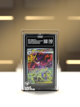 The Tank with a TAG slab of Mega Gengar inside, front view, on a white showcase in a boutique display, warm gold light.